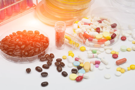 Pharmaceutical medicament, cure in container for health and fresh roasted coffee beans in plate.