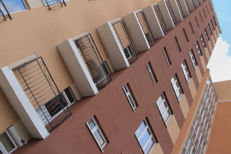 detail of a modern multi-storey apartment building with balconiesの写真素材