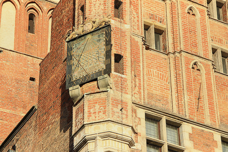 beautiful sundial on a wall of an old cathedral in Gdanskの写真素材