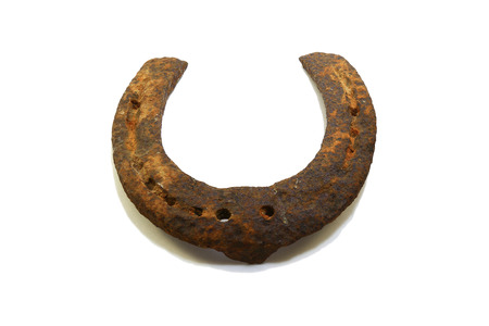 Old rusty horseshoe isolated on white backgroundの写真素材
