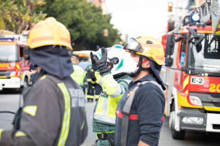 Malaga, Spain. 11th Apr 2020. Covid-19 Tribute applause to health personnel of the Hospital Carlos Haya of Málaga from local Police and Firemen.のeditorial素材