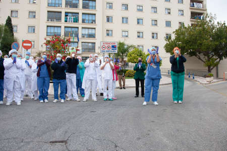 Malaga, Spain. 16th Apr 2020. Covid-19 Tribute applause to health personnel of the Hospital Carlos Haya of Málaga from local Police and Firemen.のeditorial素材