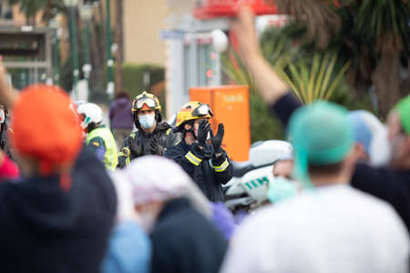 Malaga, Spain. 16th Apr 2020. Covid-19 Tribute applause to health personnel of the Hospital Carlos Haya of Málaga from local Police and Firemen.のeditorial素材
