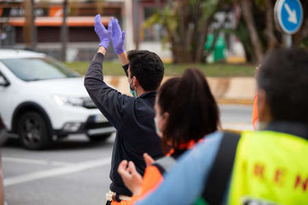 Malaga, Spain. 16th Apr 2020. Covid-19 Tribute applause to health personnel of the Hospital Carlos Haya of Málaga from local Police and Firemen.のeditorial素材