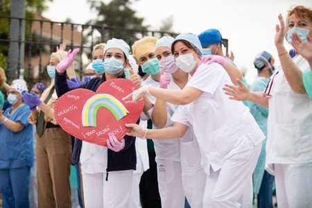 Malaga, Spain. 16th Apr 2020. Covid-19 Tribute applause to health personnel of the Hospital Carlos Haya of Málaga from local Police and Firemen.のeditorial素材