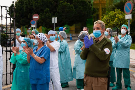 Malaga, Spain. 16th Apr 2020. Covid-19 Tribute applause to health personnel of the Hospital Carlos Haya of Málaga from local Police and Firemen.のeditorial素材