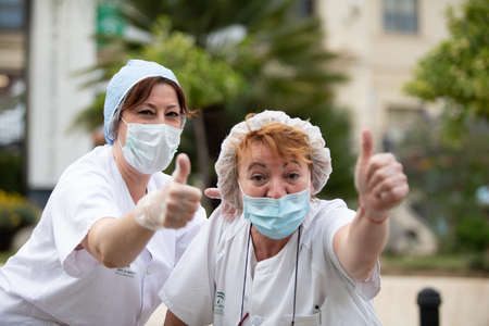 Malaga, Spain. 16th Apr 2020. Covid-19 Tribute applause to health personnel of the Hospital Carlos Haya of Málaga from local Police and Firemen.のeditorial素材