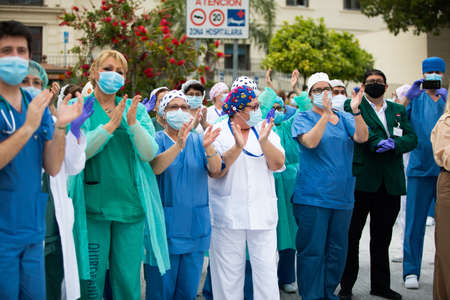 Malaga, Spain. 16th Apr 2020. Covid-19 Tribute applause to health personnel of the Hospital Carlos Haya of Málaga from local Police and Firemen.のeditorial素材