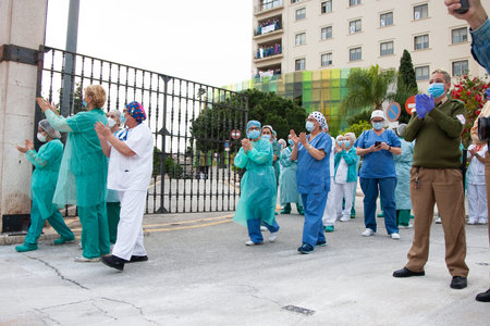 Malaga, Spain. 16th Apr 2020. Covid-19 Tribute applause to health personnel of the Hospital Carlos...