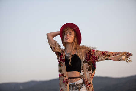 Young blonde boho female beauty on a nature backgroundの写真素材