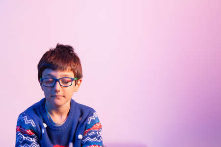 A young boy christmas daydreaming. Studio shootingの写真素材