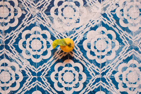 Still Life yellow lemon in a white and blue vintage backgroundの写真素材