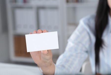 Close-up of business card in women hand.の写真素材