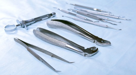 Medical instruments for dentists on blue tableの写真素材