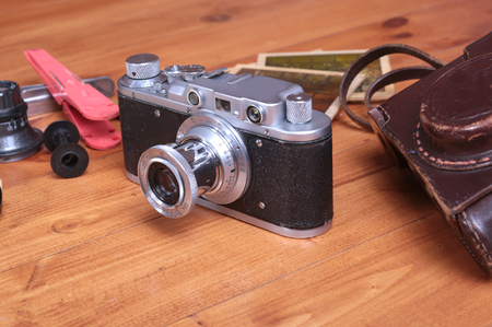 Vintage camera and accesoriess on wooden backgroundの写真素材