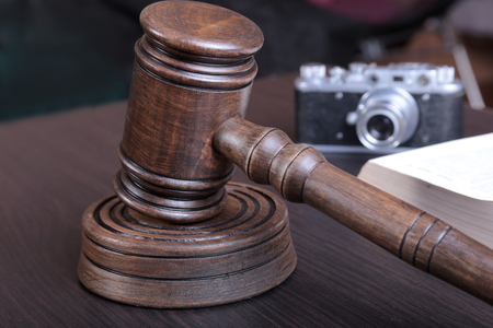 auction hammer , symbol of authority and vintage camera.の写真素材