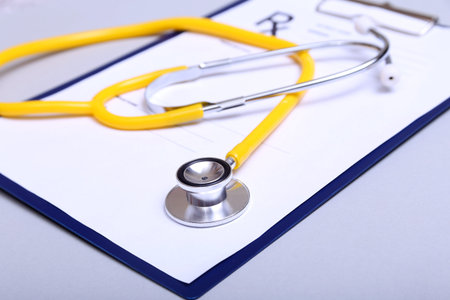 Stethoscope and medical equipment on a light background.