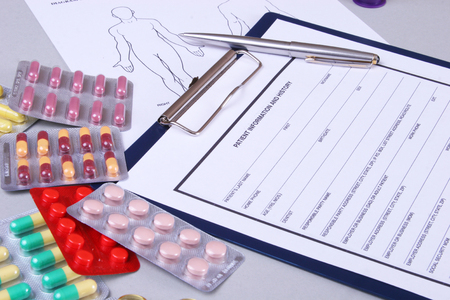 Closeup of a pils, stethoscope, pen on an rx prescription.の写真素材