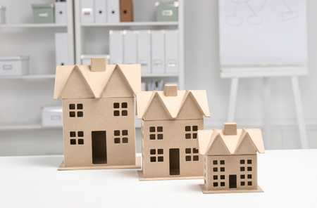 Miniature houses on the desk in officeの写真素材