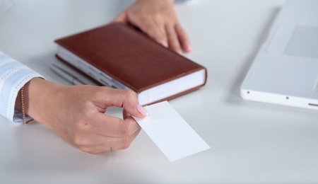 Close-up of business card in women handの写真素材