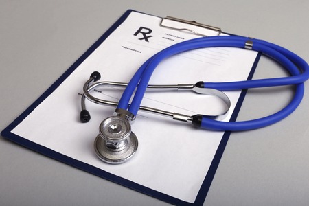 Stethoscope, red heart and medical equipmenton on backgroundの写真素材