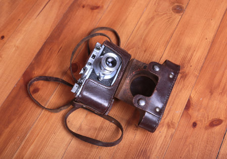 Vintage old film photo-camera in leather caseの写真素材