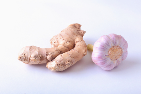 fresh ginger and garlic isolated on white background.の写真素材