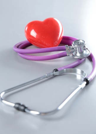 medical stethoscope, RX prescription and red heart isolated on white background. selective focus.の写真素材