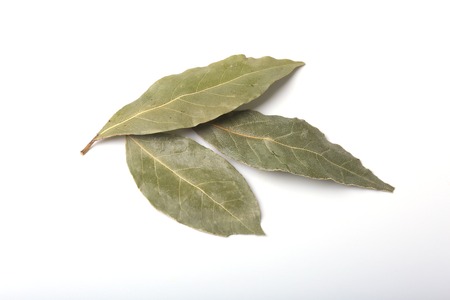 Aromatic dried bay leaves on white background.の写真素材