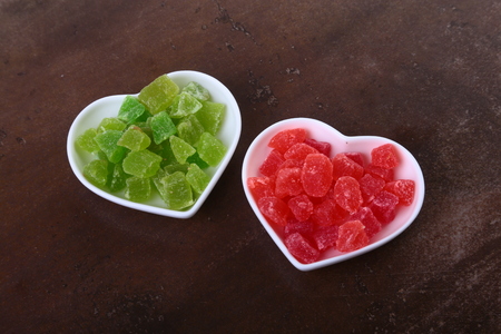 Delicious assorted dried organic fruit in bowl isolated on black backgroundの写真素材