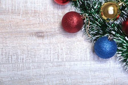 Christmas decorations with coloured balls on wooden backgroundの写真素材