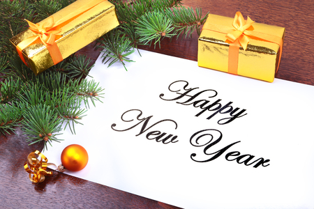 Christmas gift box on a wooden desktop with letter for copy space.の写真素材
