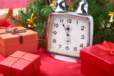Christmas vintage clock. New Years Decoration with gift boxes, christmas balls and tree. Celebration Concept for New Year.の写真素材