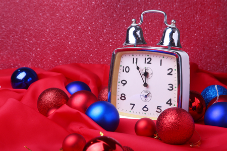 Christmas clock. New Years Decoration with christmas balls and tree. Celebration Concept for New Year.の写真素材