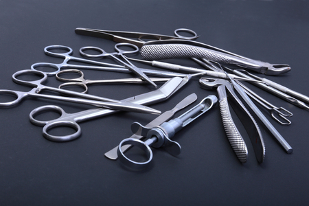 Medical and surgery instruments isolated in black mirror backgroundの写真素材