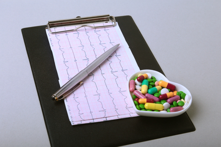 RX prescription and colorful assortment pills and capsules on plate.の写真素材