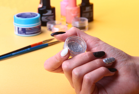 Black, white Nail art manicure. Holiday style bright Manicure with sparkles. Beauty hands. Stylish Nails, Nail Polishの写真素材