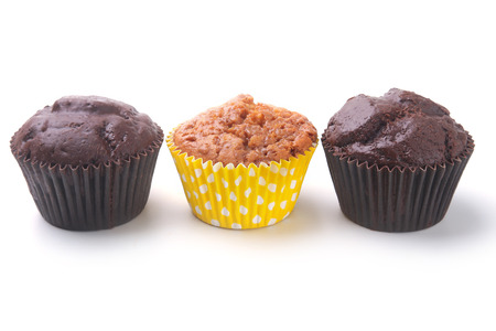 Assorted with Delicious homemade cupcakes with raisins and chocolate isolated on white background. Muffins. Top view.の写真素材