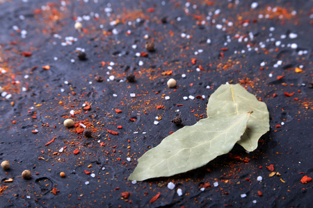 Red spices, salt and pepper on black marble. Black abstract background. Top viewの写真素材