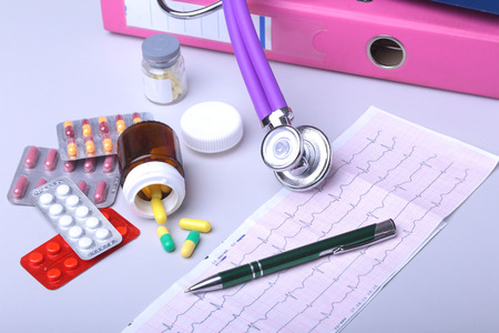 Close-up stethoscope lying on RX prescription with assorted pills. Healthy life or insurance conceptの写真素材