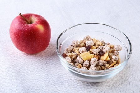 Healthy food with Corn Flakes cereal in a bowl, apple, banana and glass with milk. Morning breakfast.の写真素材