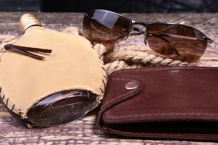 Stylish mens business accessories. Watch, wallet, bottle with cologne on wooden background.の写真素材