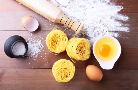 egg, flour, salt, ingredients for pasta penne bologneseの写真素材