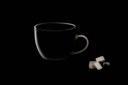 coffee cup on a black background with steam. Dark tone.Space for text.の写真素材