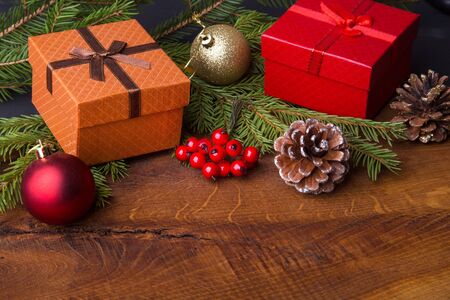 New Year or Christmas decorations with gift boxes, candles and balls.の写真素材