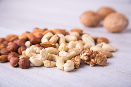 Assortment nuts on wooden table. Close up.