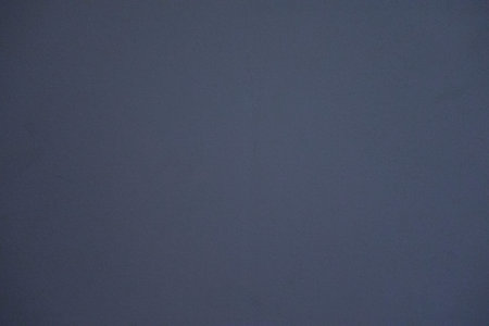 Background of a smooth wall of a dark blue colorの写真素材