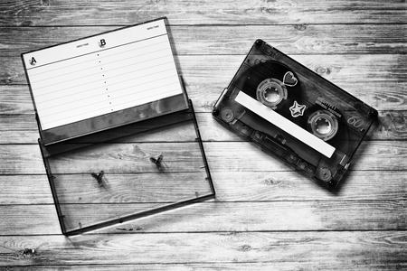 Old cassette tapes with a wooden backgroundの写真素材