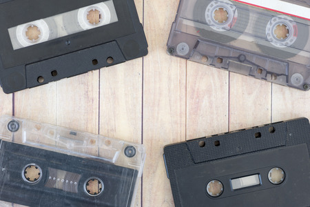 Old cassette tapes with a wooden backgroundの写真素材