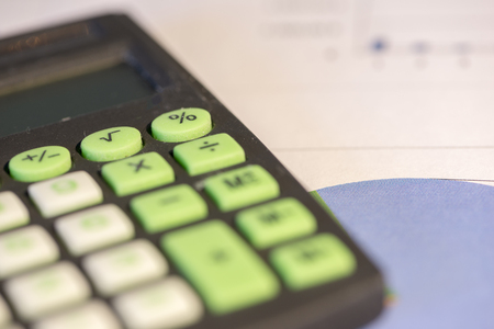 Calculator and accounting documents on a tableの写真素材